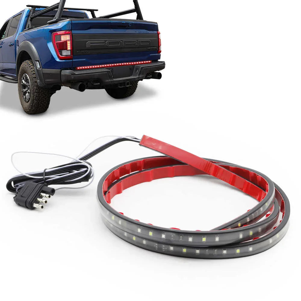LED strip light with power cord in front of a blue pickup truck on a white background