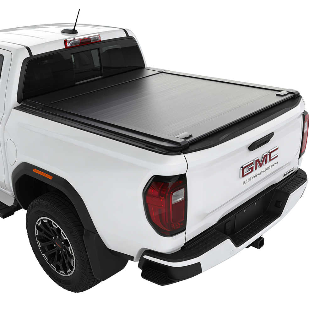 White GMC Canyon truck with a black enhanced mb tonneau cover on a white background