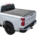 White Chevrolet Silverado truck with a tonneau cover on a white background