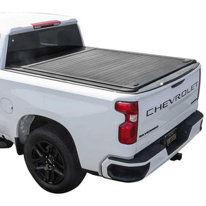White Chevrolet Silverado truck with a tonneau cover on a white background