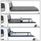 Collapsible soft roll-up truck bed cover shown in three stages of deployment on a white truck.