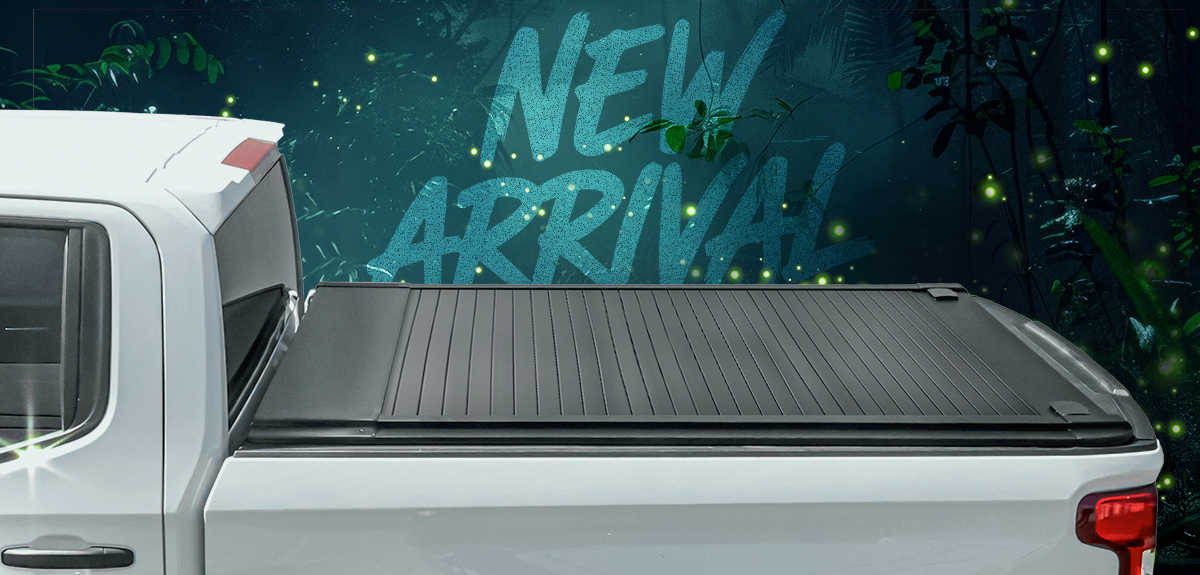 White truck with a black tonneau cover against a dark background with 'NEW ARRIVAL!' text.