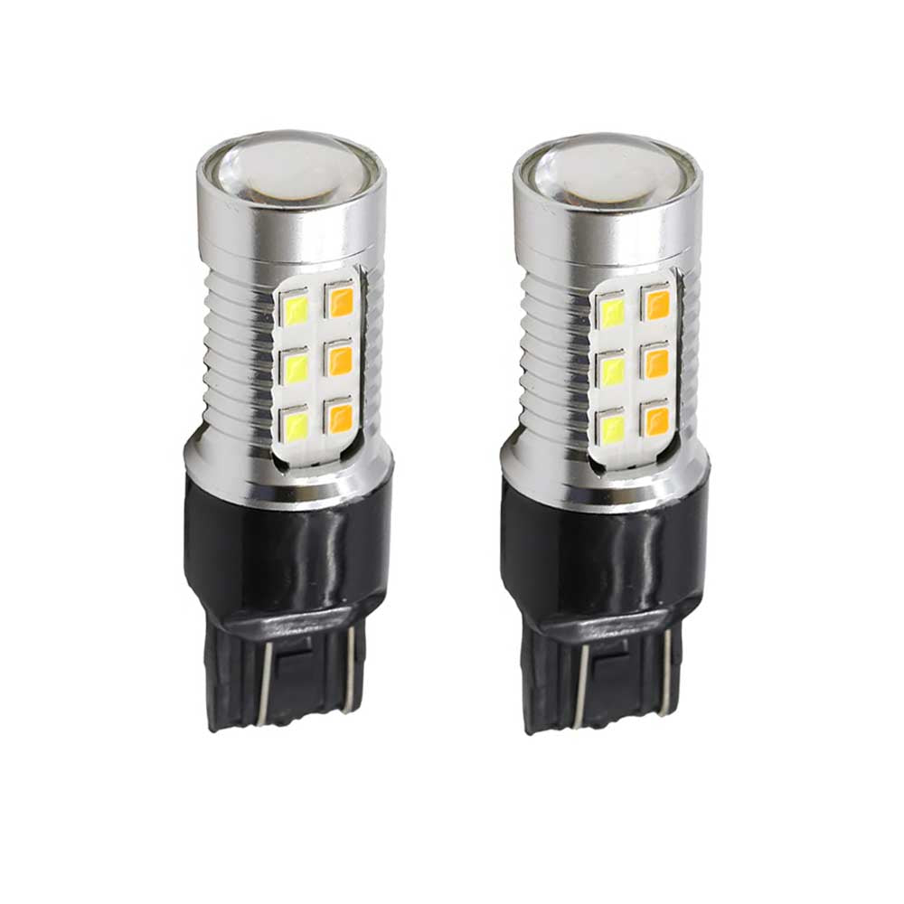 Two LED light bulbs with a white and amber color, designed for use in vehicle lighting, with a plug and socket connection type.