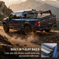 Blue truck with built-in T-slot rails with soft roll-up cover on a mountain road