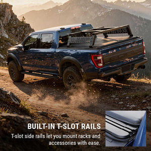 Blue truck with built-in T-slot rails with soft roll-up cover on a mountain road