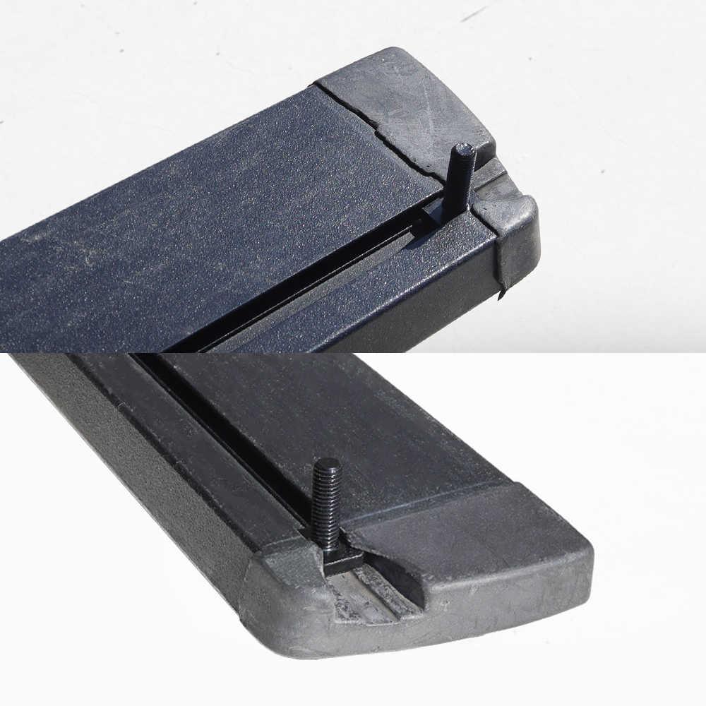 Close-up of a black metal component on a white background