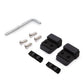 Set of black block components and a silver tool on a white background