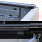 Close-up of a vehicle's open cargo area with a black cover.