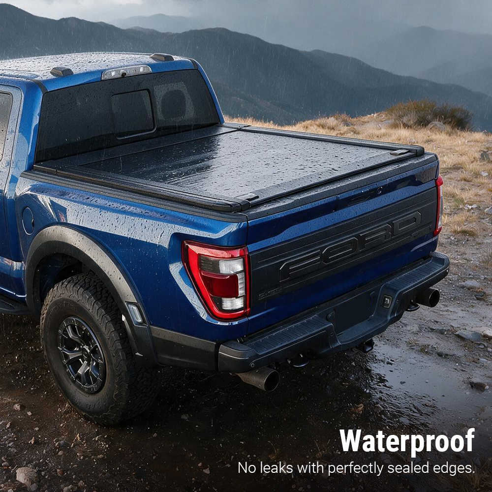 A blue Ford pickup truck parked outdoors on a rocky mountain road, shown from the rear three-quarter angle with a black tonneau cover over the bed. Text in the lower right reads 'Waterproof' and 'No leaks with perfectly sealed edges.