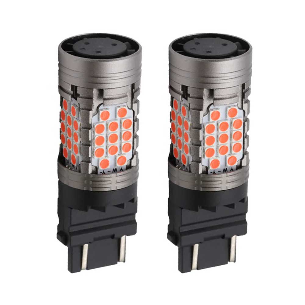 Two red LED brake reverse turn signal bulbs with aluminum housing, designed for use in various vehicle lights.