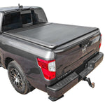 Gray pickup truck with a SYNETICUSA AR retractable PRO tonneau cover on a white background