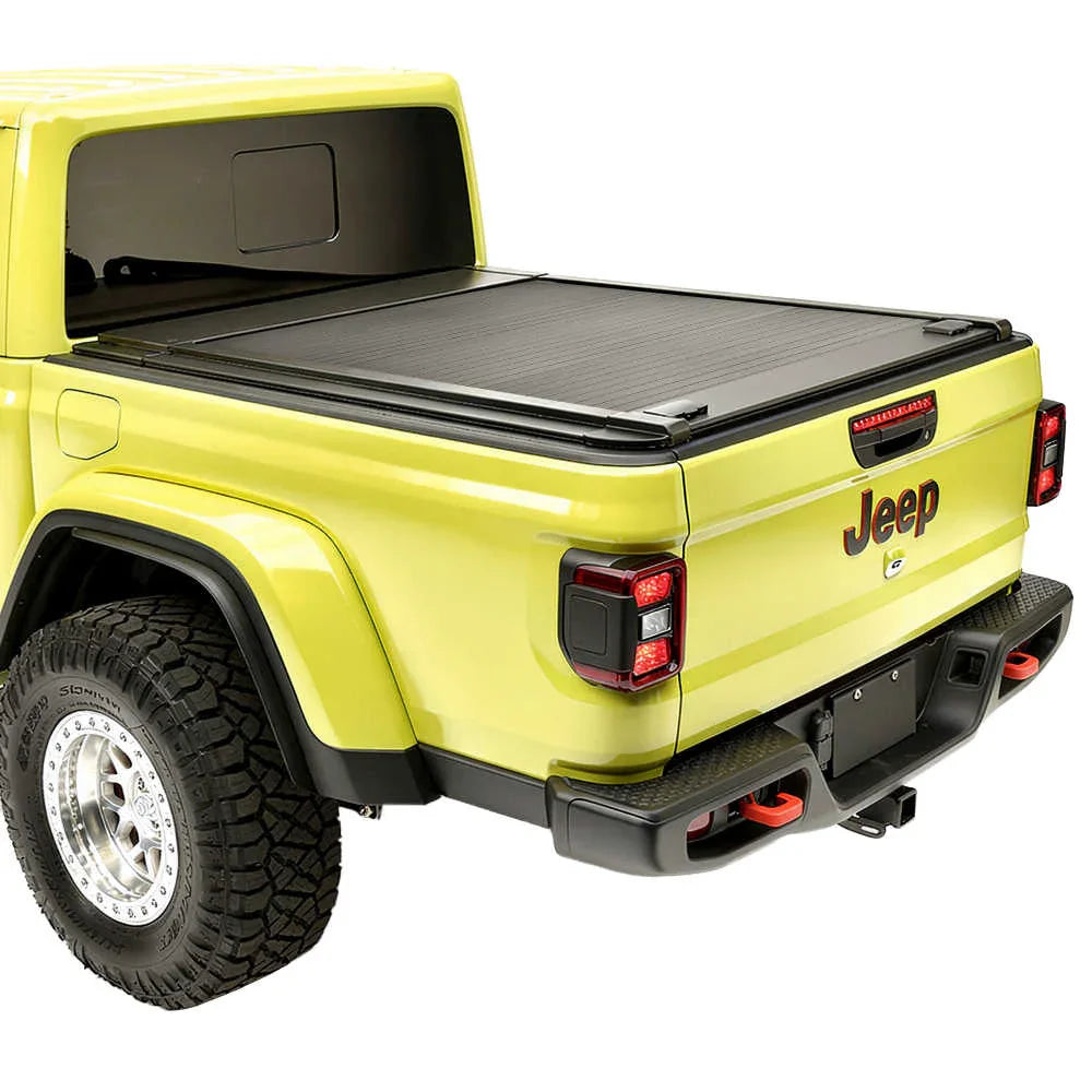 Yellow Jeep truck with a enhanced MB tonneau cover on a white background