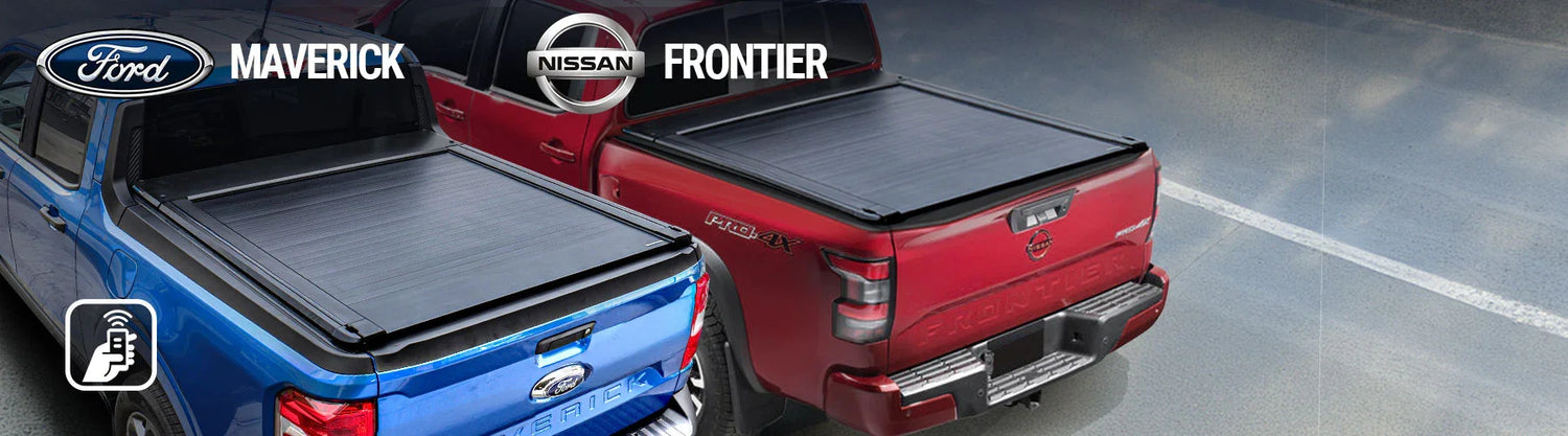 Two trucks, one blue and one red, with tonneau covers on a gray surface.