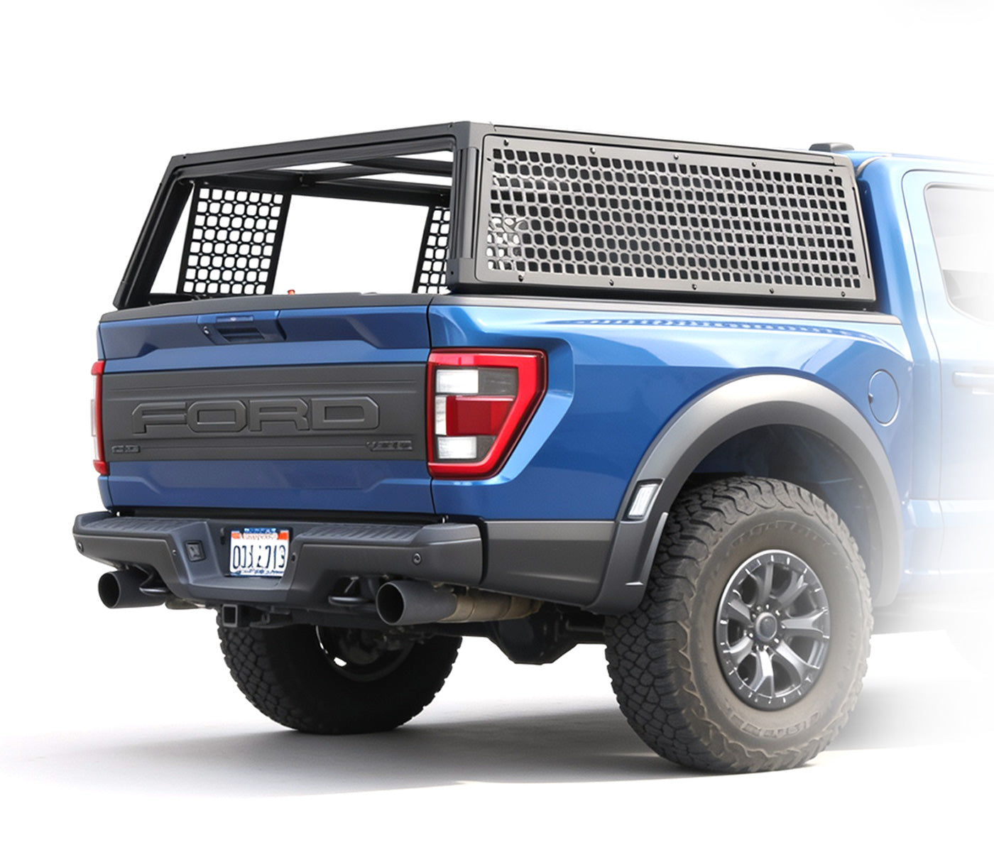 SYNETICUSA's Flex Modular Cap Basecamp package installed on blue Ford Raptor on white background.