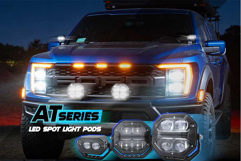 Blue pickup truck shown from the front at night with multiple LED spot light pods mounted on the front bumper and grille area, plus three close-up product views overlaid at the bottom with the text 'ATSERIES LED SPOT LIGHT PODS'.